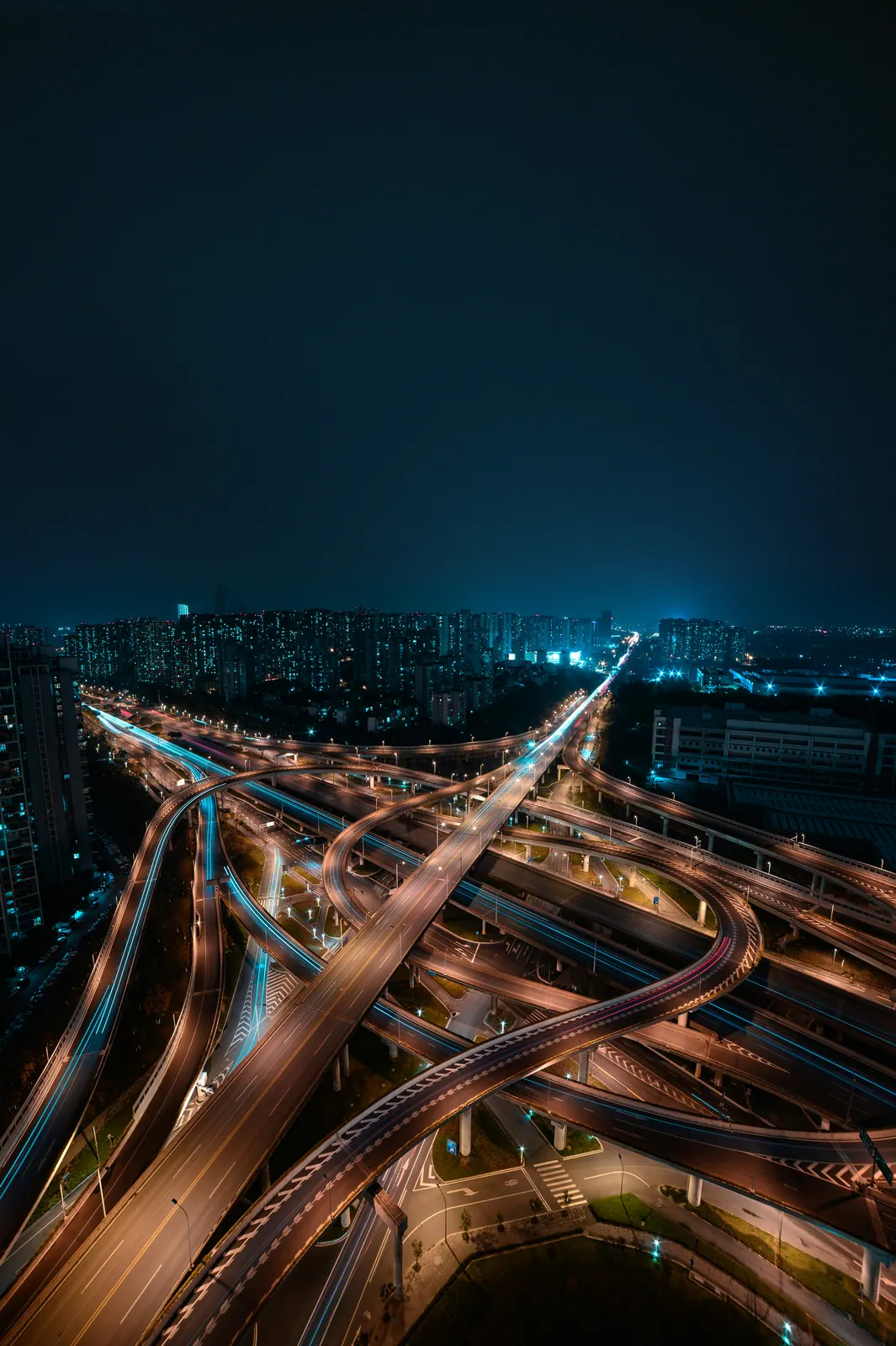 Aerial view of an illuminated motorway interchange at night