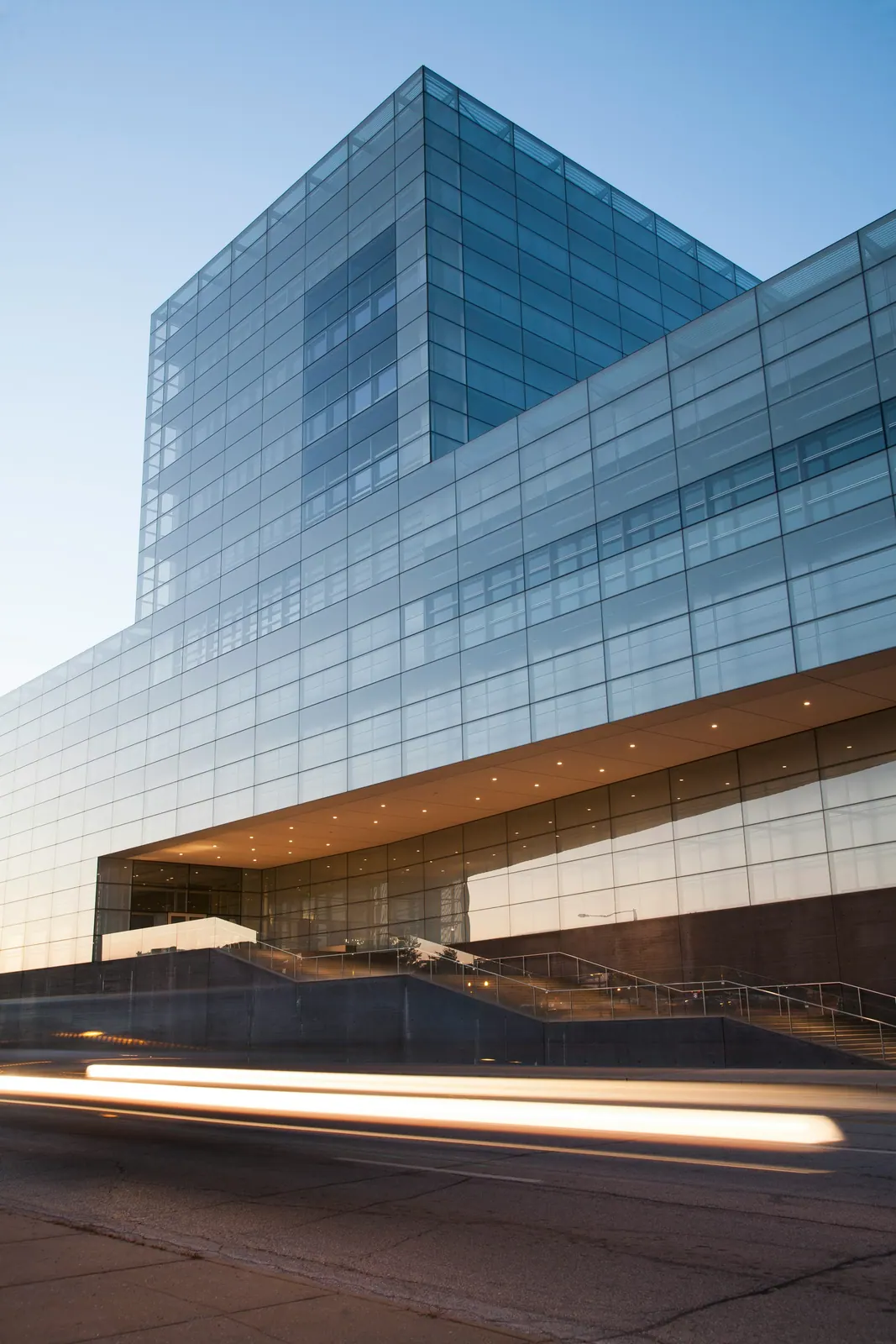 Glass office tower at dusk